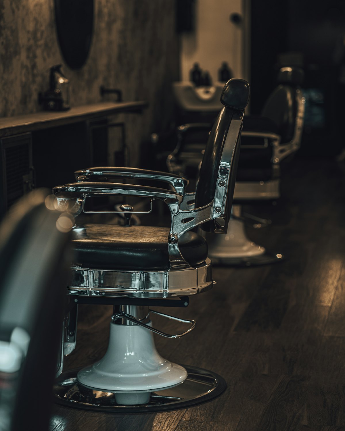 Barber chairs lined up in the shop