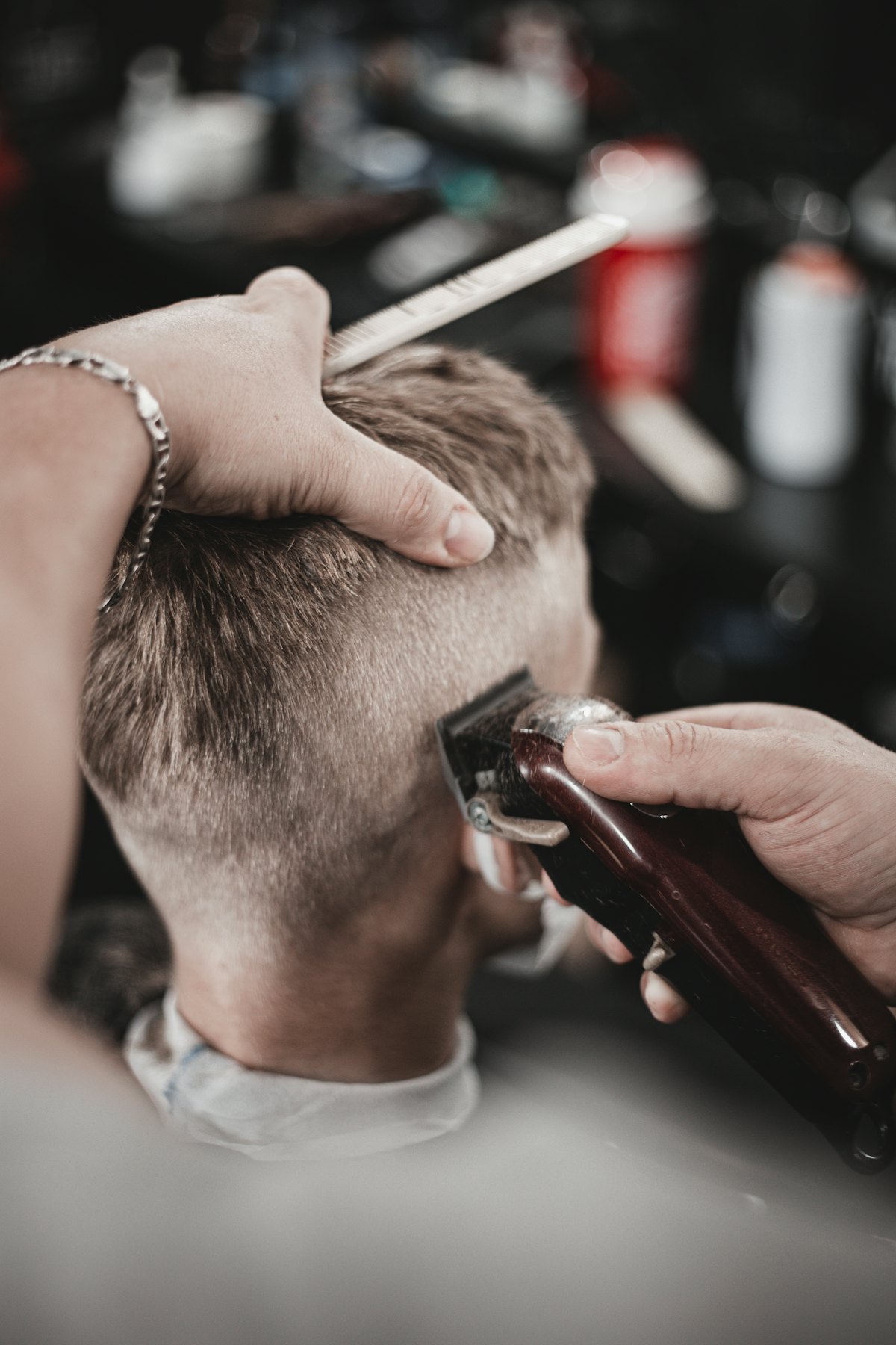 A clean skin fade being finished with clippers