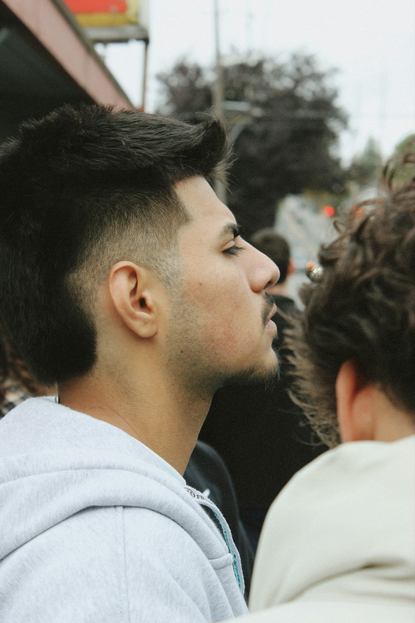 A sharp side profile with a high fade and textured top