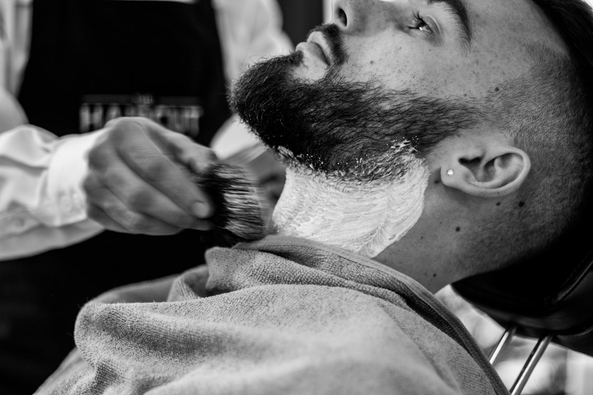 A customer lathered up for a traditional shave